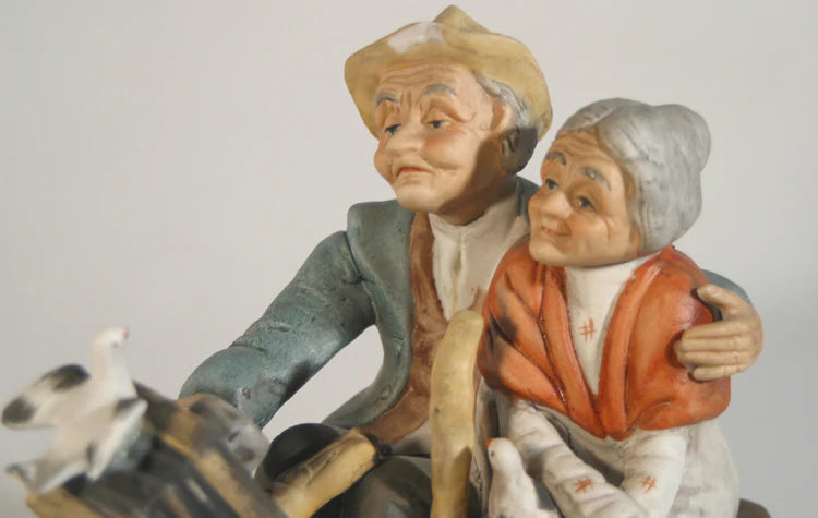 EDLERLY COUPLE WATCH THE BIRDIE PORCELINE FIGURE