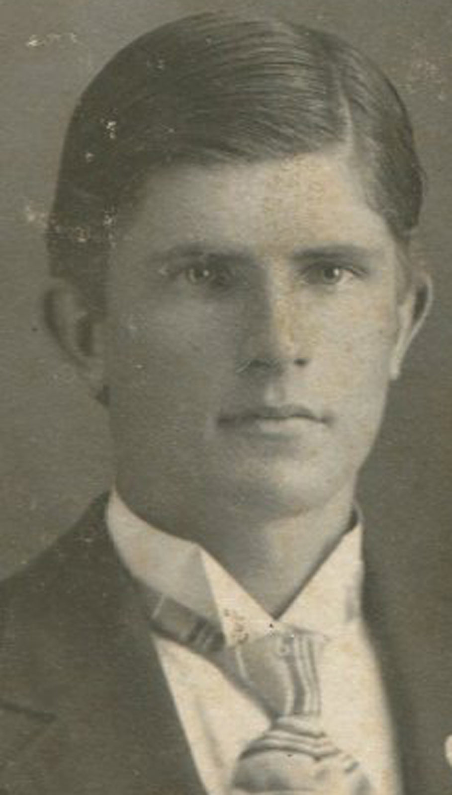 YOUNG MAN, DEEP SET EYES, FANCY TIE. RIDGWAY, PA.