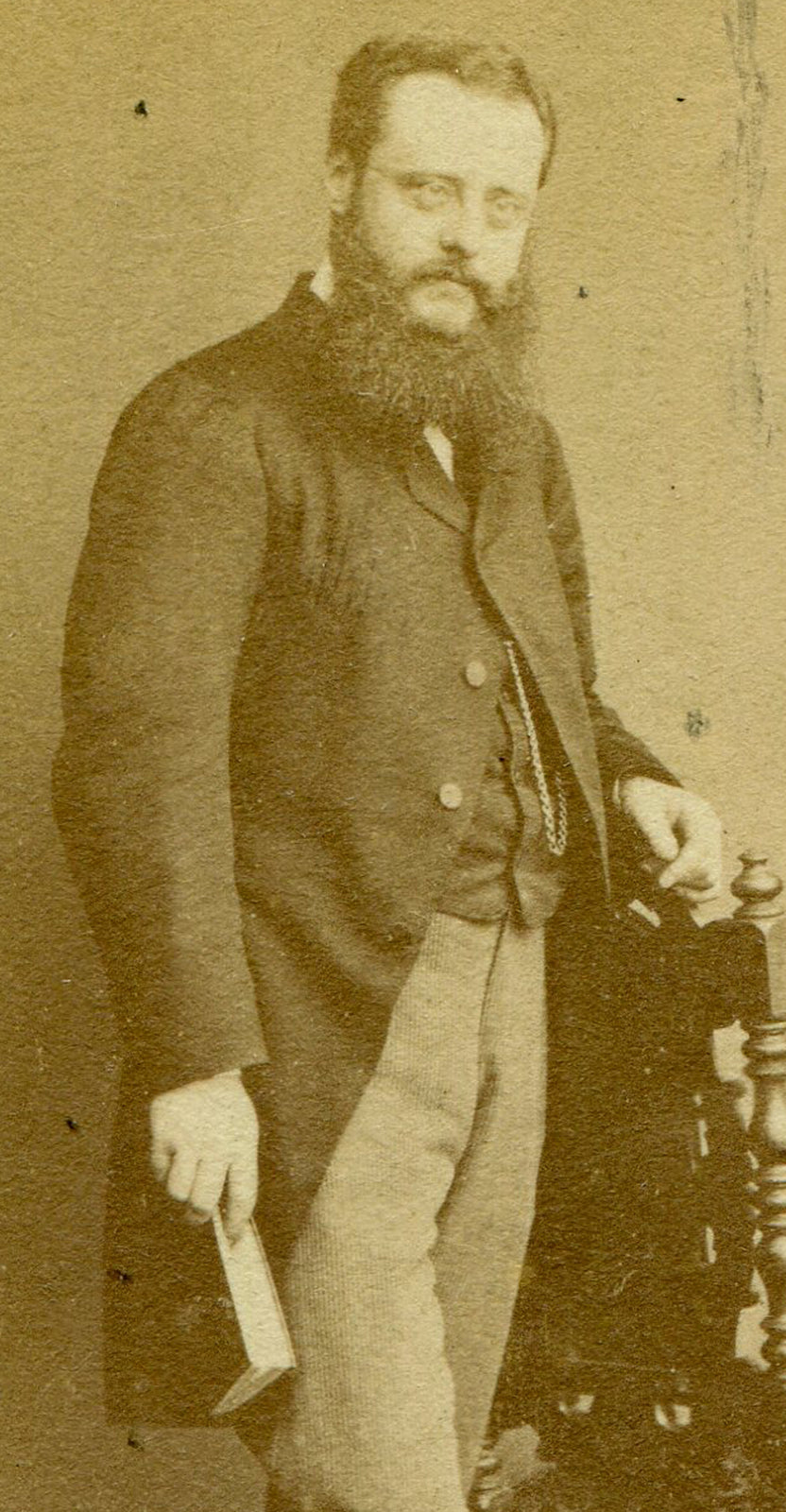 BEARDED MAN POSED HOLDING BOOK. CDV. LONDON, ENGLAND.