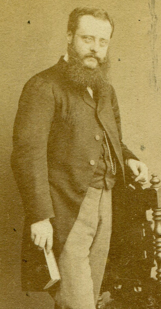 BEARDED MAN POSED HOLDING BOOK. CDV. LONDON, ENGLAND.