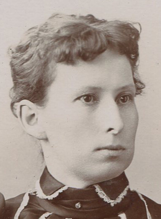 VERY LONG FACED WOMAN IN VERTICAL STRIPED DRESS. CABINET CARD. PORTLAND, ME.
