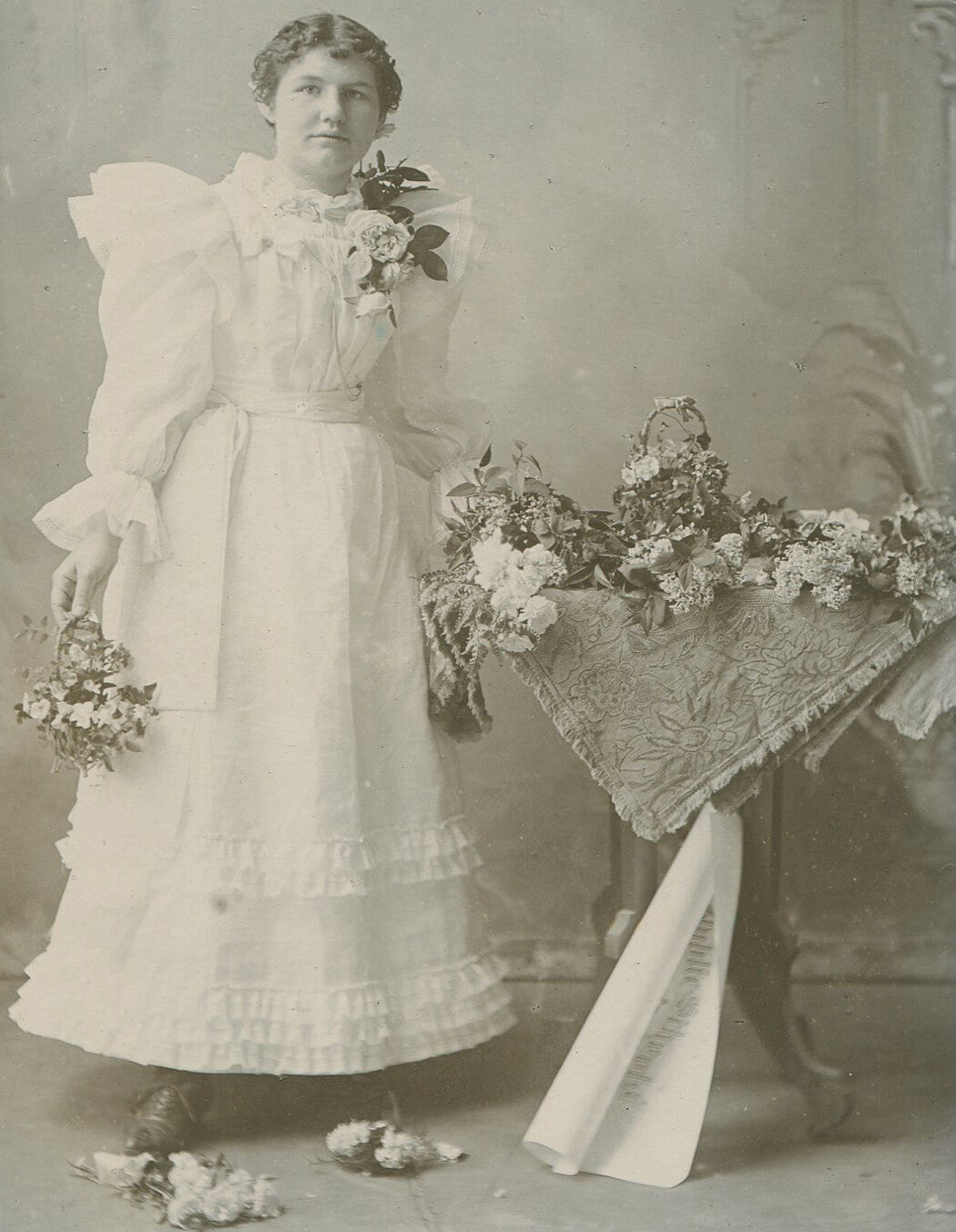 YOUNG WOMAN, POUFY DRESS AND LOTS OF CUT FLOWERS. PRETTY. CABINET CARD, KANSAS.