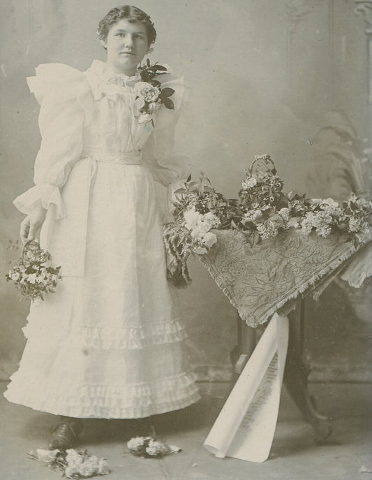YOUNG WOMAN, POUFY DRESS AND LOTS OF CUT FLOWERS. PRETTY. CABINET CARD, KANSAS.