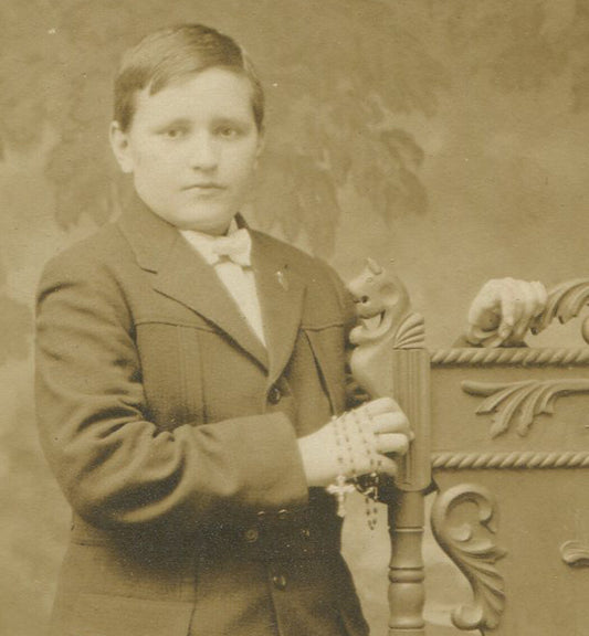 BOY HOLDING ROSARY, DRESSED IN KNICKERS. RELIGIOUS. SILVER PRINT CIRCA 1900.