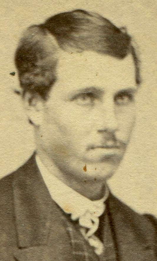 MAN IN LOOSE SUIT, SLICK HAIR, SEATED ON POSING CHAIR. CDV.