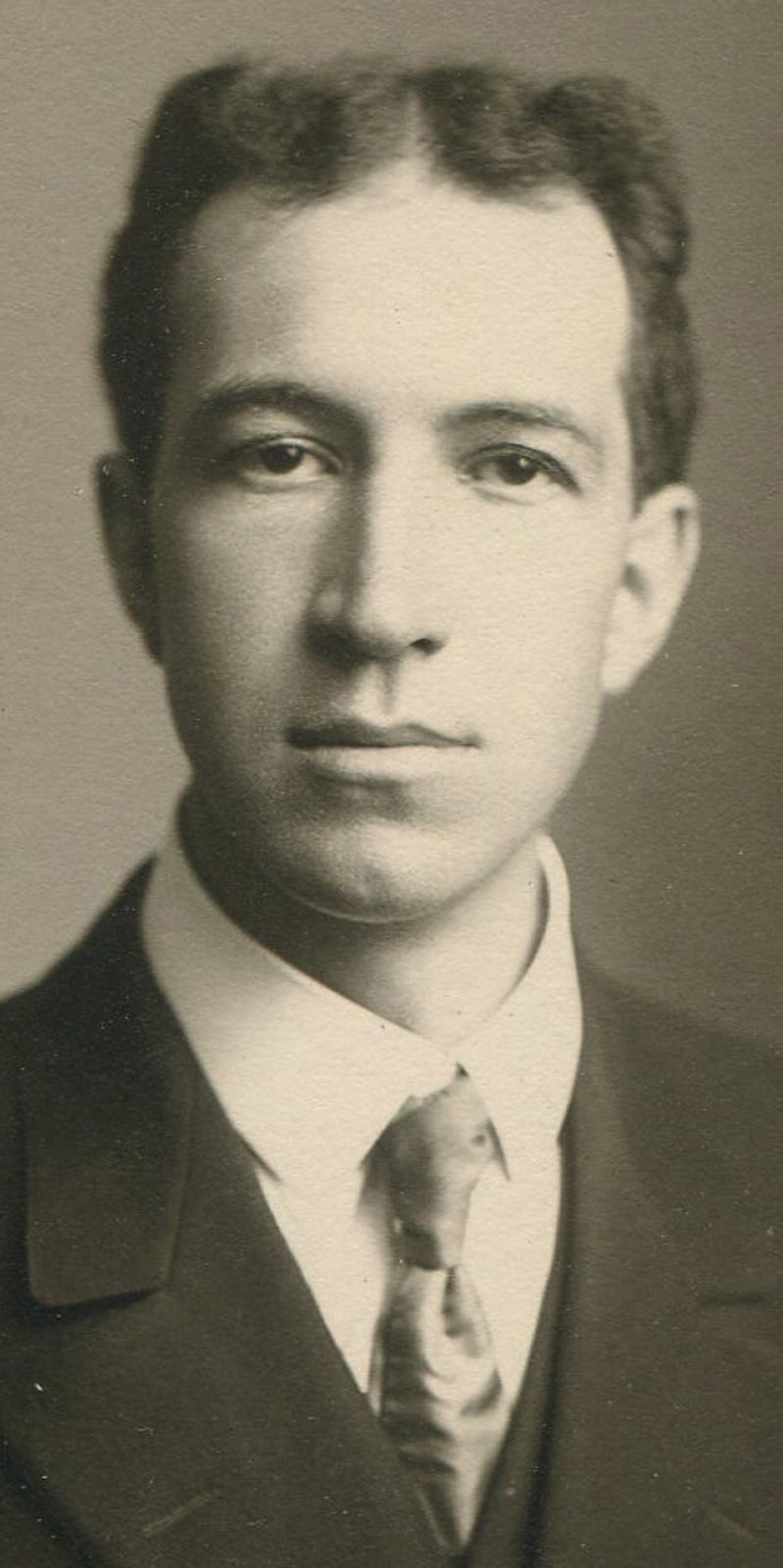 Vintage photograph Man with Uneven Gaze - Silver print, circa 1920, 5.5x2.75 image, original old photo