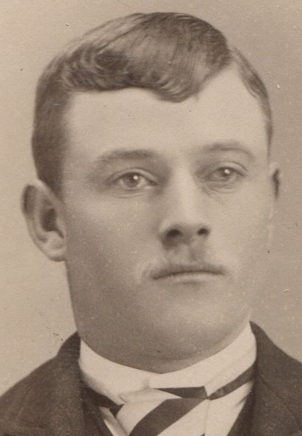 YOUNG MAN DREAMING OF A REAL MUSTACHE. CABINET CARD. AKRON, OHIO.