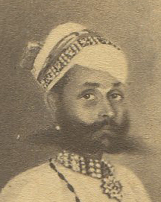 MAN IN TRADITIONAL SETTING. INDIA, 19TH CEN. INDIA. ARTWORK ON CDV.