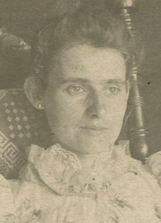 THIN, ANGULAR WOMAN IN FLORAL DRESS, ROCKING CHAIR. CABINET CARD.