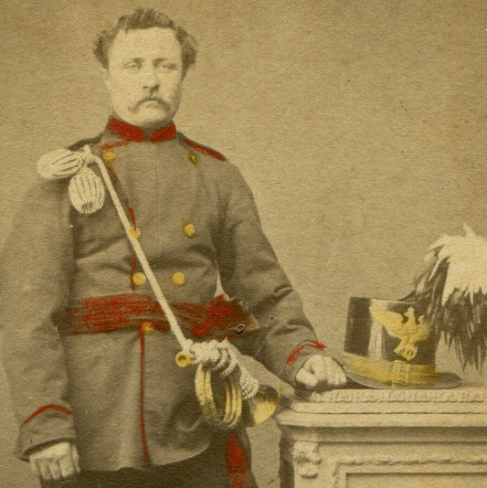 MAN IN UNIFORM, PARADE HAT AND HORNE. TINTED CDV. GERMANY.