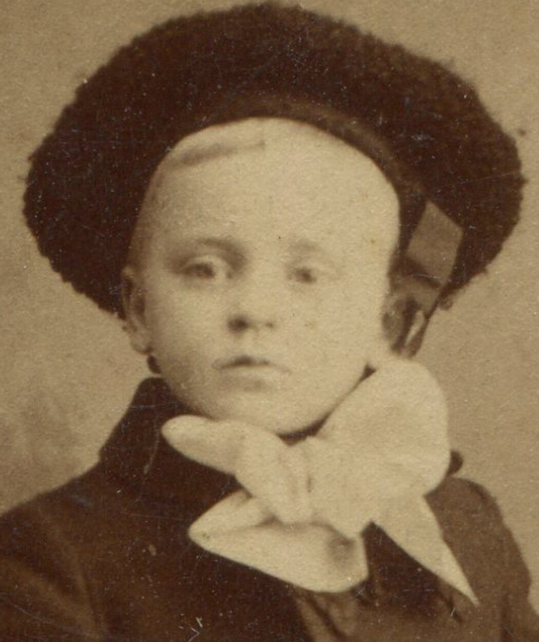 YOUNG BOY IN WINTER WEAR, RELAXED POSE. CDV.  N.Y.C.