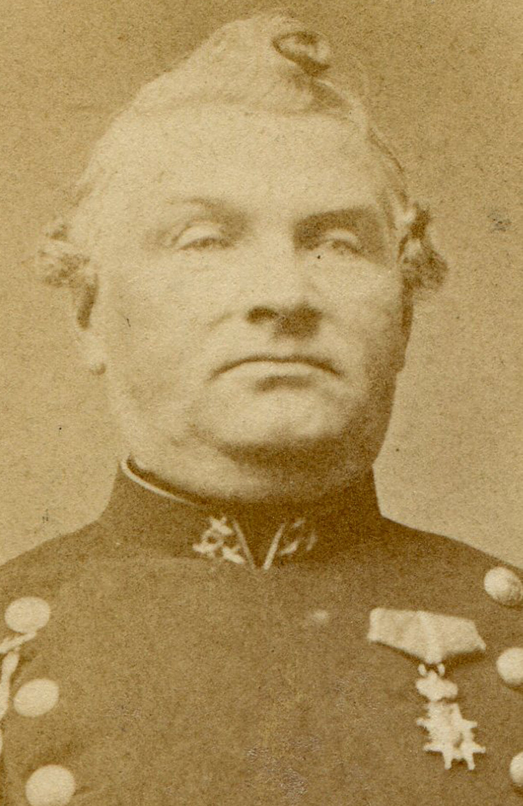 MAN IN MILITARY UNIFORM WITH CUPIE DOLL HAIR CURL. CDV.