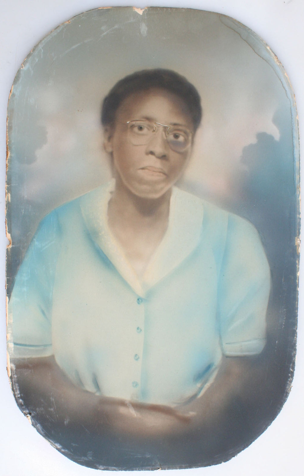 AFRICAN AMERICAN WOMAN, GOLD RIMMED GLASSES, BLUE DRESS. HAND TINTED PORTRAIT.