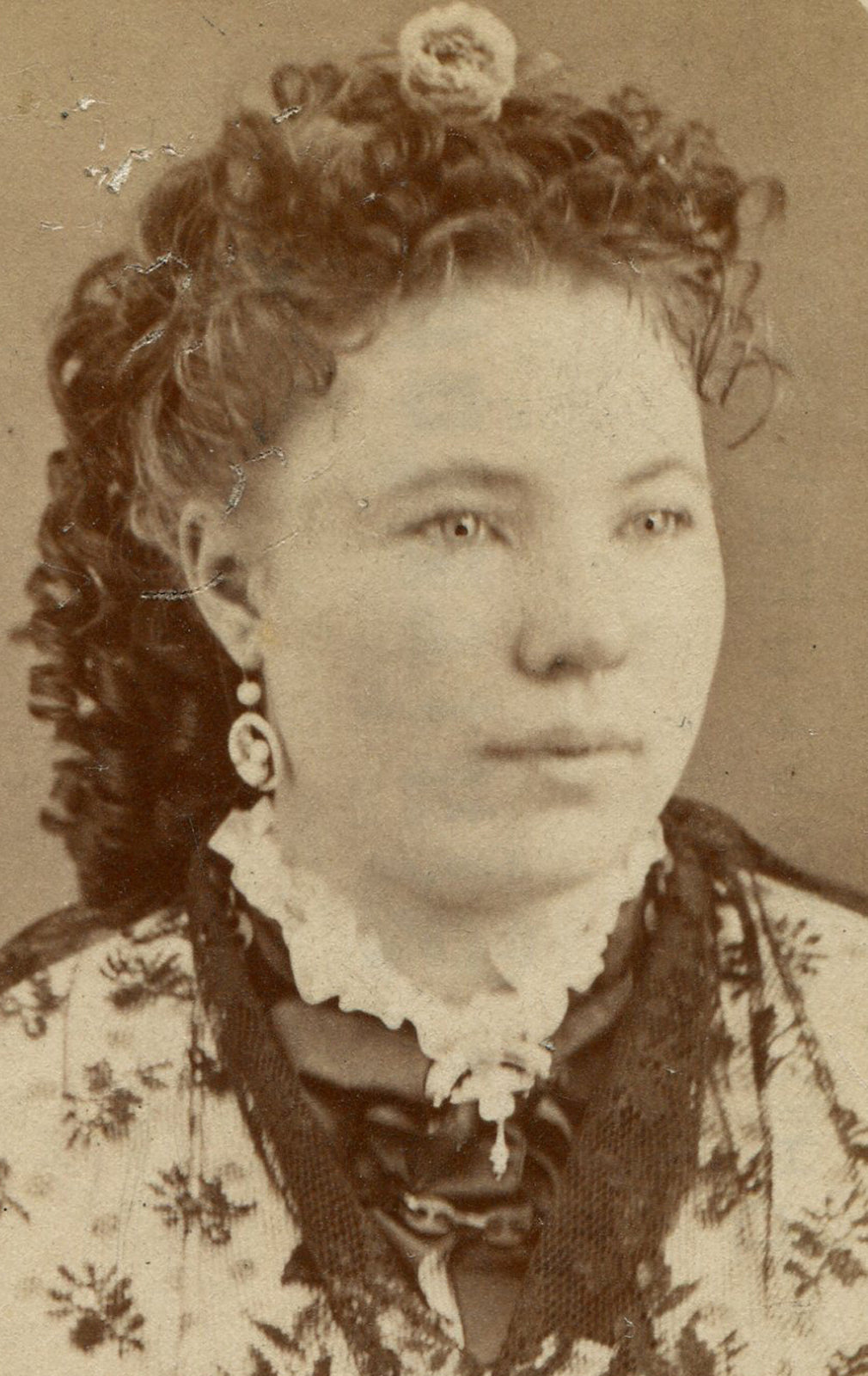WOMAN, COMPLICATED APPEARANCE. CURLY HAIR, LACE TOP. CDV. PARKER CITY, PA.