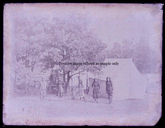NATIVE AMERICAN FAMILY IN RURAL SETTING. GLASS PLATE NEGATIVE, 8.5 X 6.5 INCHES.