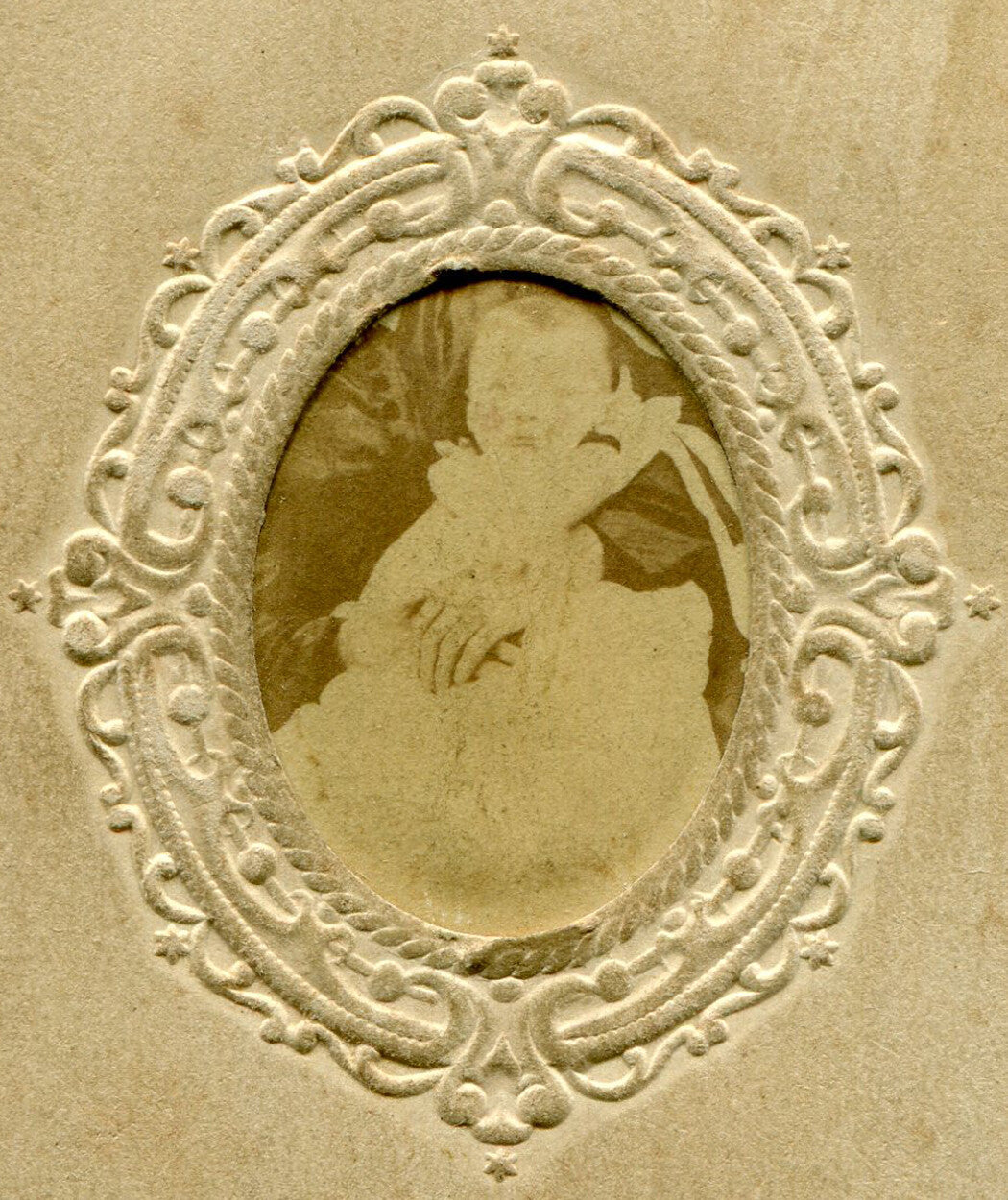 BABY W/HIDDEN MOTHER. UNMOUNTED ALBUMEN IN PERIOD PAPER MAT.