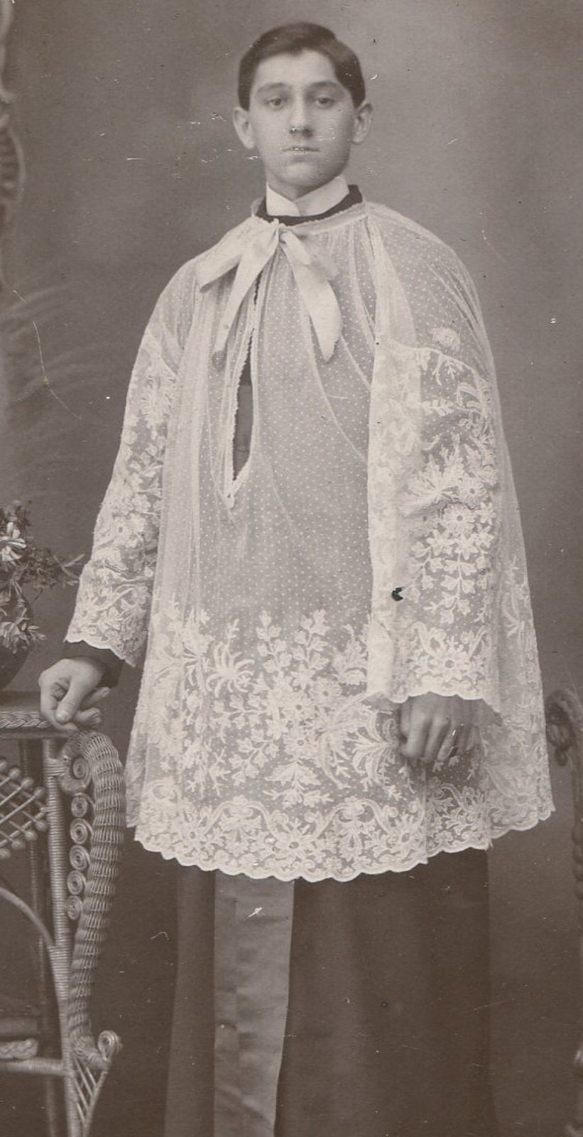 ALTER BOY IN REGALIA. STANDING POSE, SERIOUS EXPRESSION. CABINET CARD.