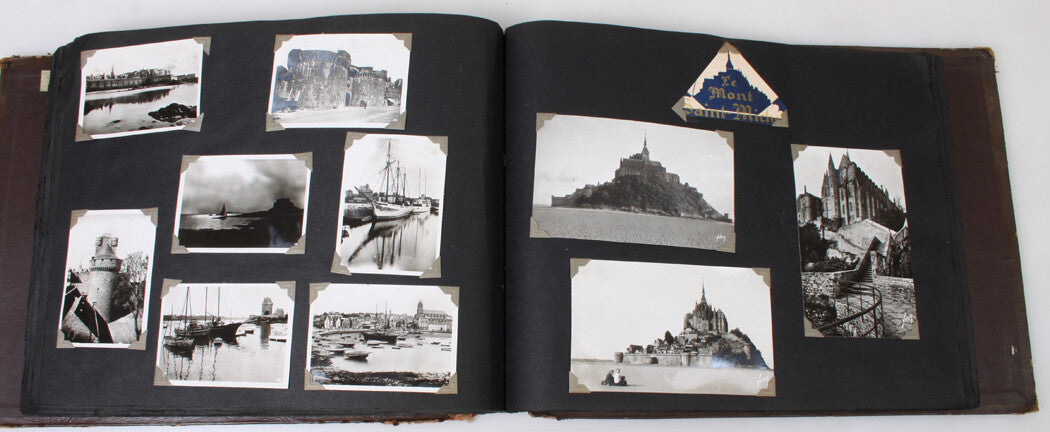 WORLD TRAVELERS PERSONAL PHOTO AND POSTCARD IN LEATHER BOUND ALBUM.