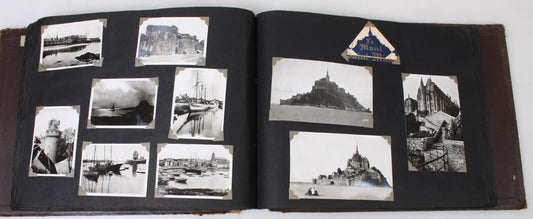 WORLD TRAVELERS PERSONAL PHOTO AND POSTCARD IN LEATHER BOUND ALBUM.