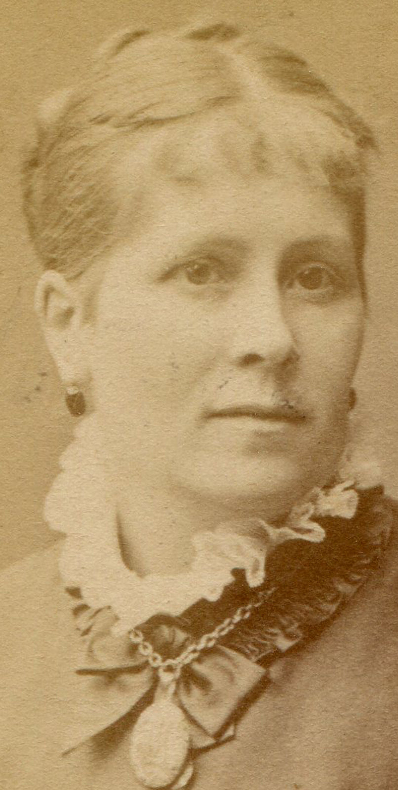 WOMAN SEATED, ARMS CROSSED, RUFFLED SLEEVES. CDV. STOCKHOLM, SWEDEN.