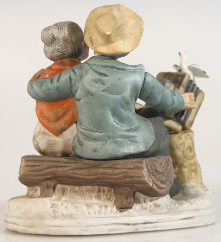 EDLERLY COUPLE WATCH THE BIRDIE PORCELINE FIGURE