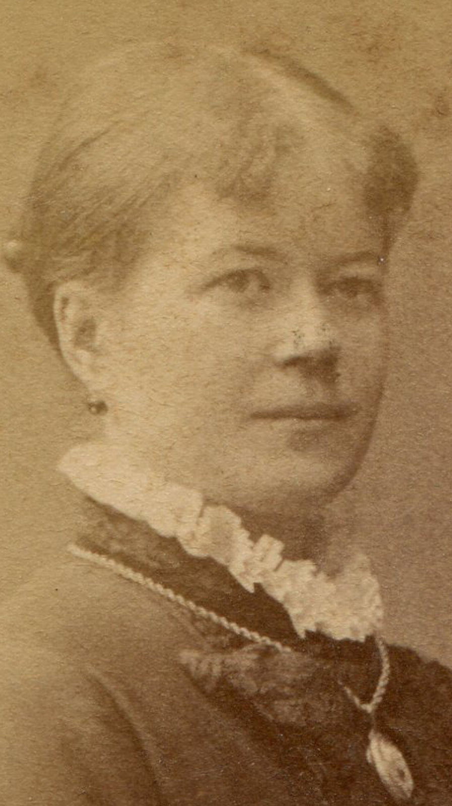 WOMAN, STATELY POSE, HANDS AT REST ON CHAIR. CDV. STOCKHOLM, SWEDEN.