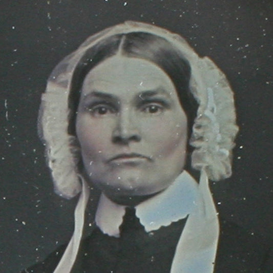 WOMAN, STRONG CHEEK BONES, BONNET. TINTED 6TH PLATE DAGUERREOTYPE, FULL CASE.
