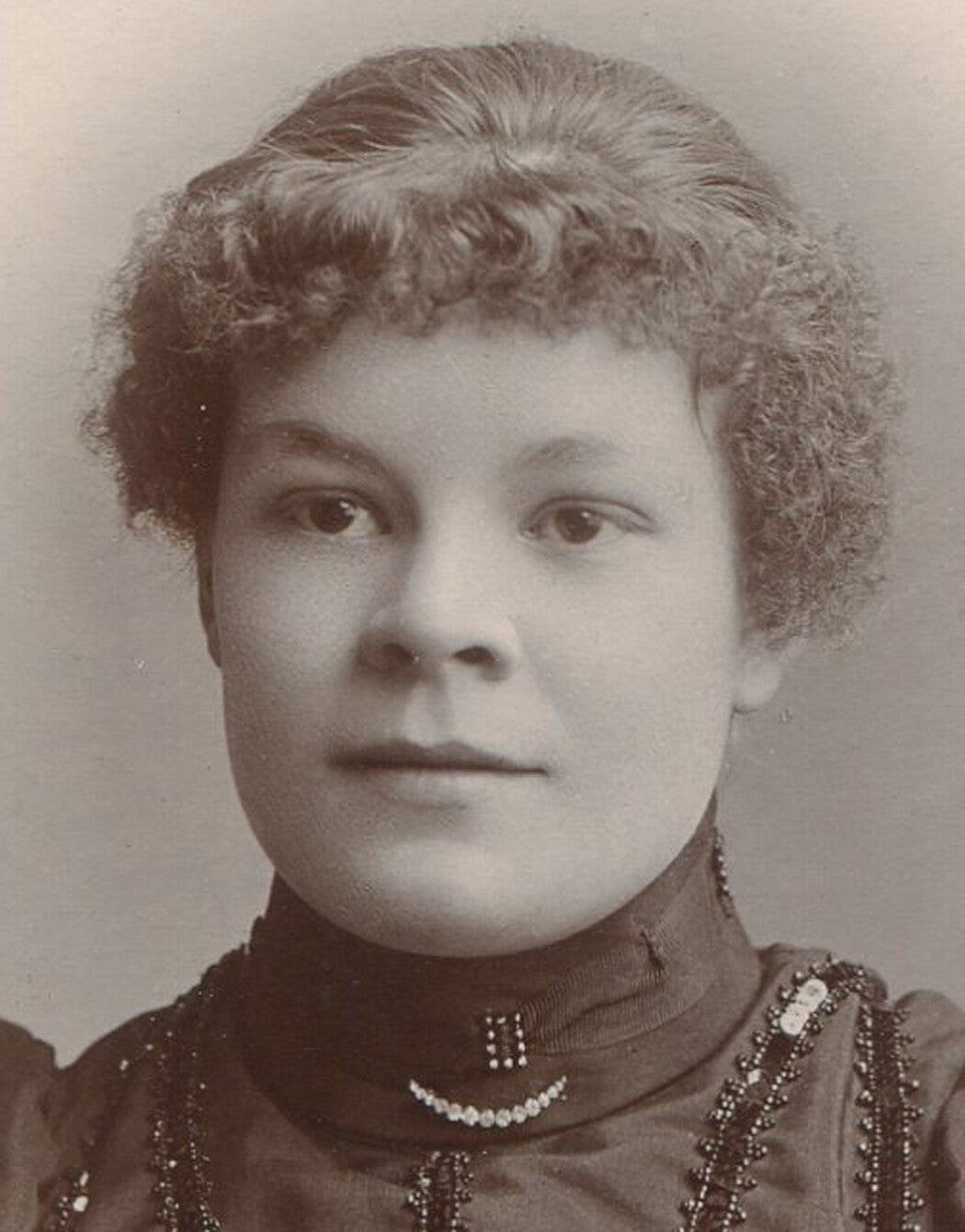 WOMAN IN BEADED, SEQUIN TRIMMED DRESS. CABINET CARD. ENGLAND.