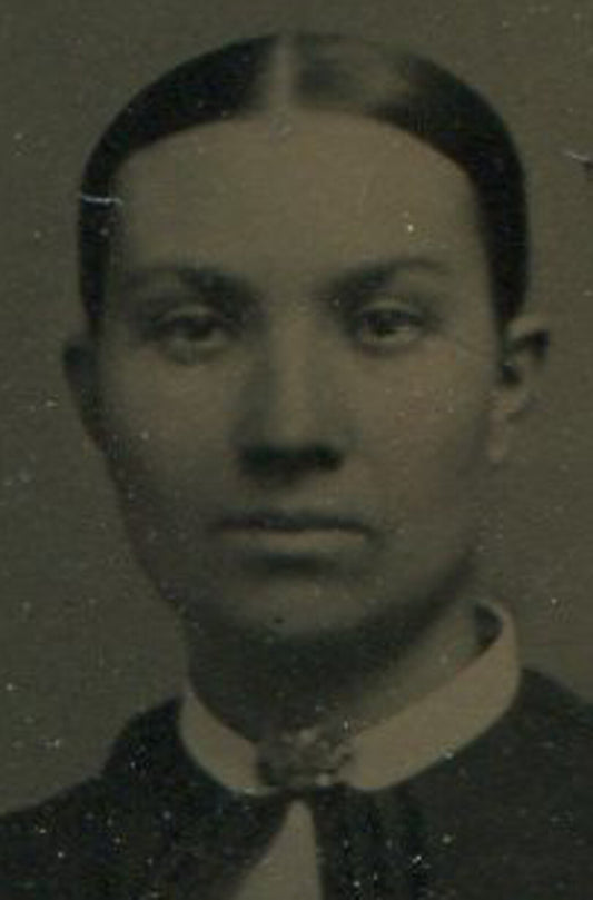 WOMAN W/BIG EYES, PULLED BACK HAIR. GEM SIZE TINTYPE.