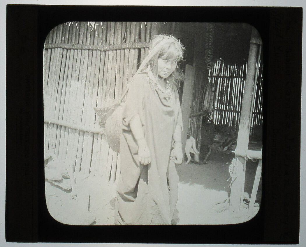 YOUNG INDIGENOUS WOMAN CARRYING YUCCA. PERU. PHOTO ON GLASS.