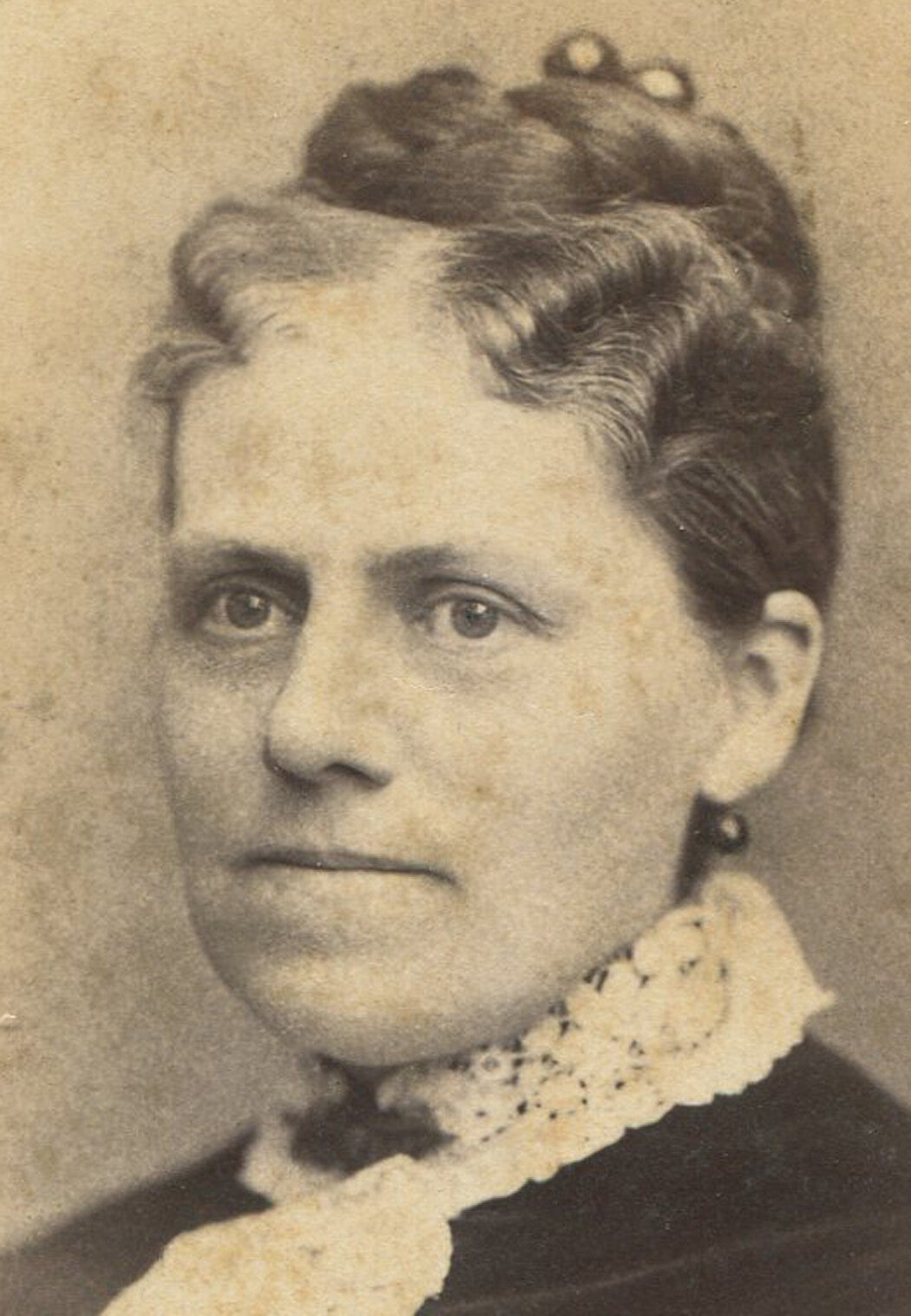 WOMAN, VERY NICELY STYLED HAIR, LACE COLOR. CABINET CARD. NEWARK, N.J.