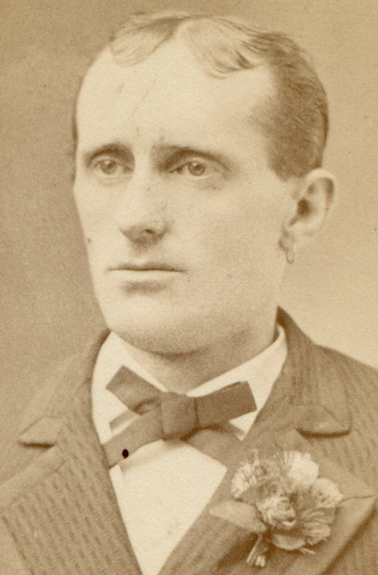 MAN WITH COMB FORWARD HAIR, BOW TIE AND CORSAGE. CDV. BRISTOL, N.H.
