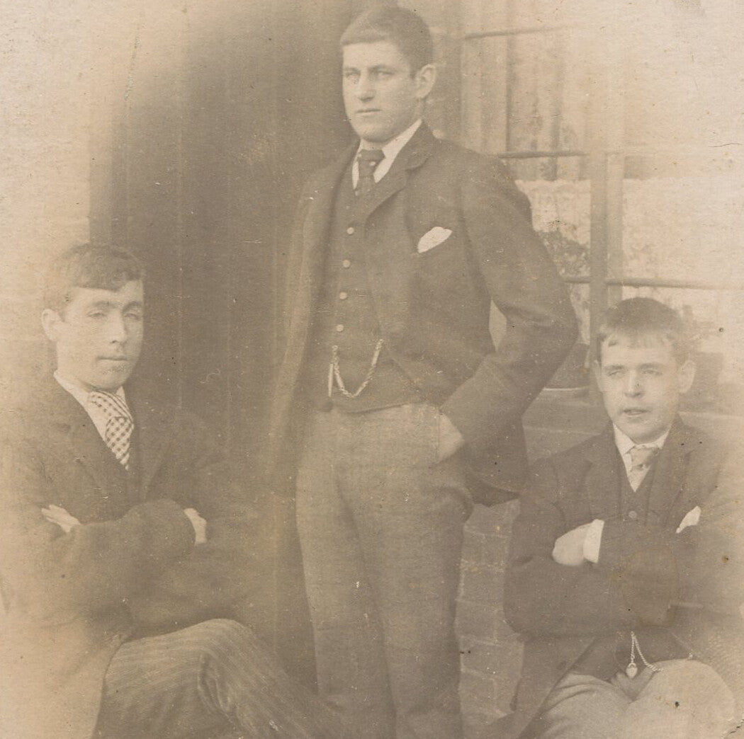 THREE BROTHERS POSED W/CROSSED ARMS, HANDS IN POCKETS. CABINET CARD.