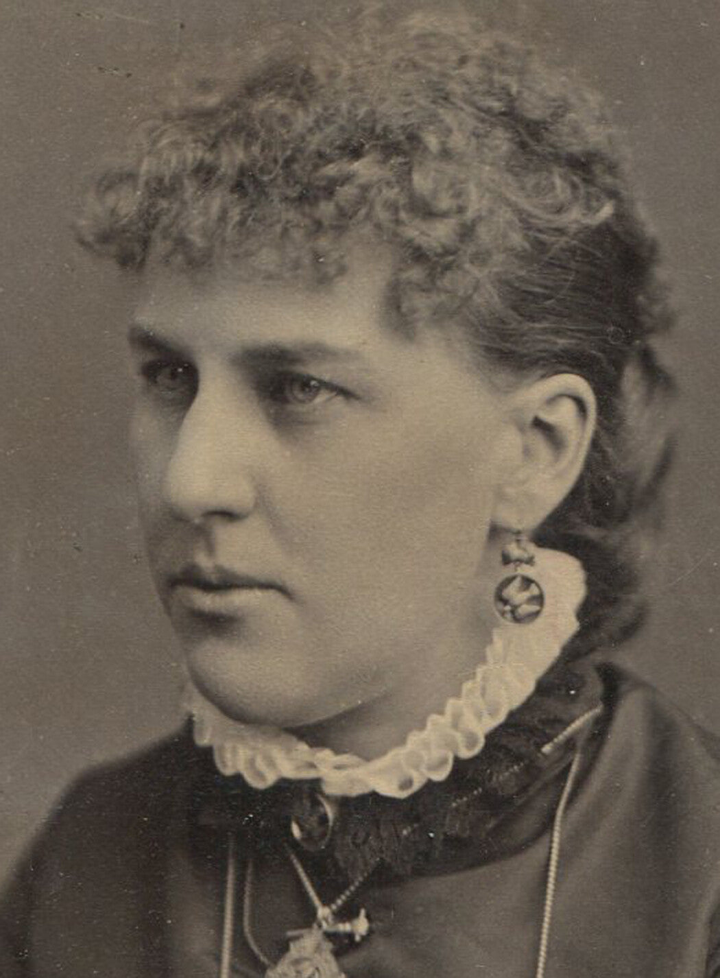 WOMAN WEARING MANY RUFFLES AND JEWELRY. CABINET CARD, BIDDEFORD, MAINE.