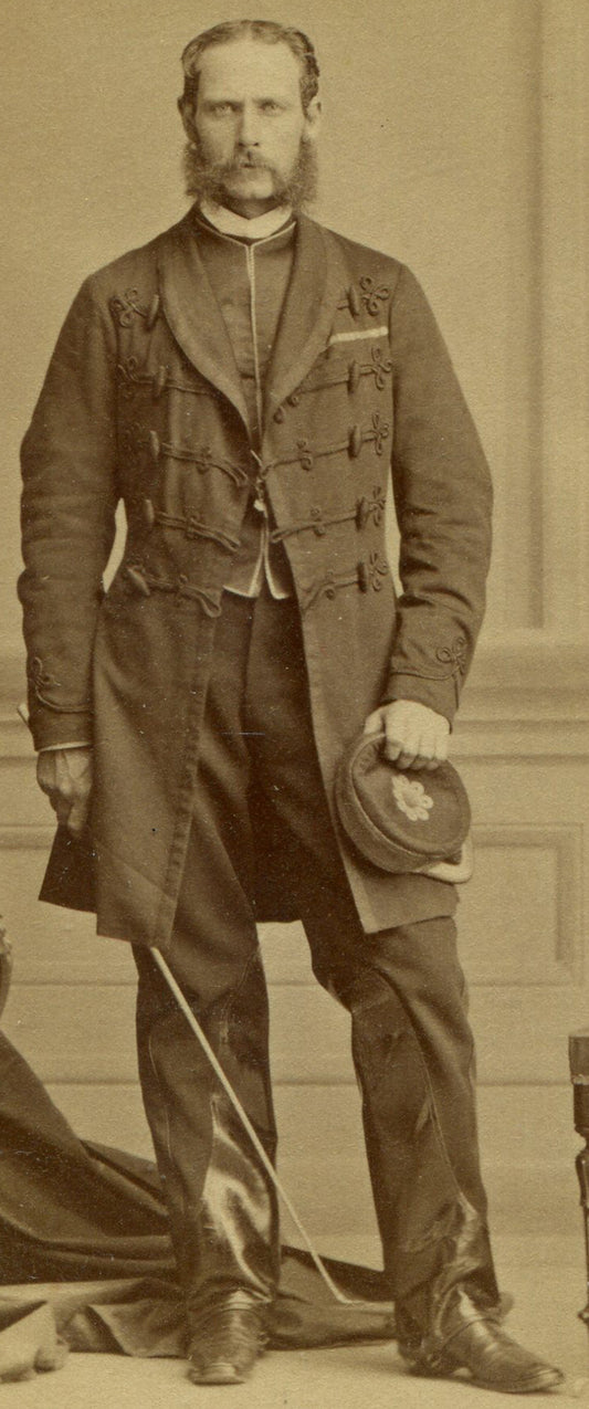 MAN IN ORNATE LONG COAT, KEPI, RIDING CROP, LEATHER TRIMMED PANTS. CDV. MONTREAL