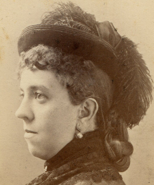 WOMAN, PROFILE POSE, COMPLICATED HAIR, HAT WITH FUZZY PLUMB. CDV. R.I.