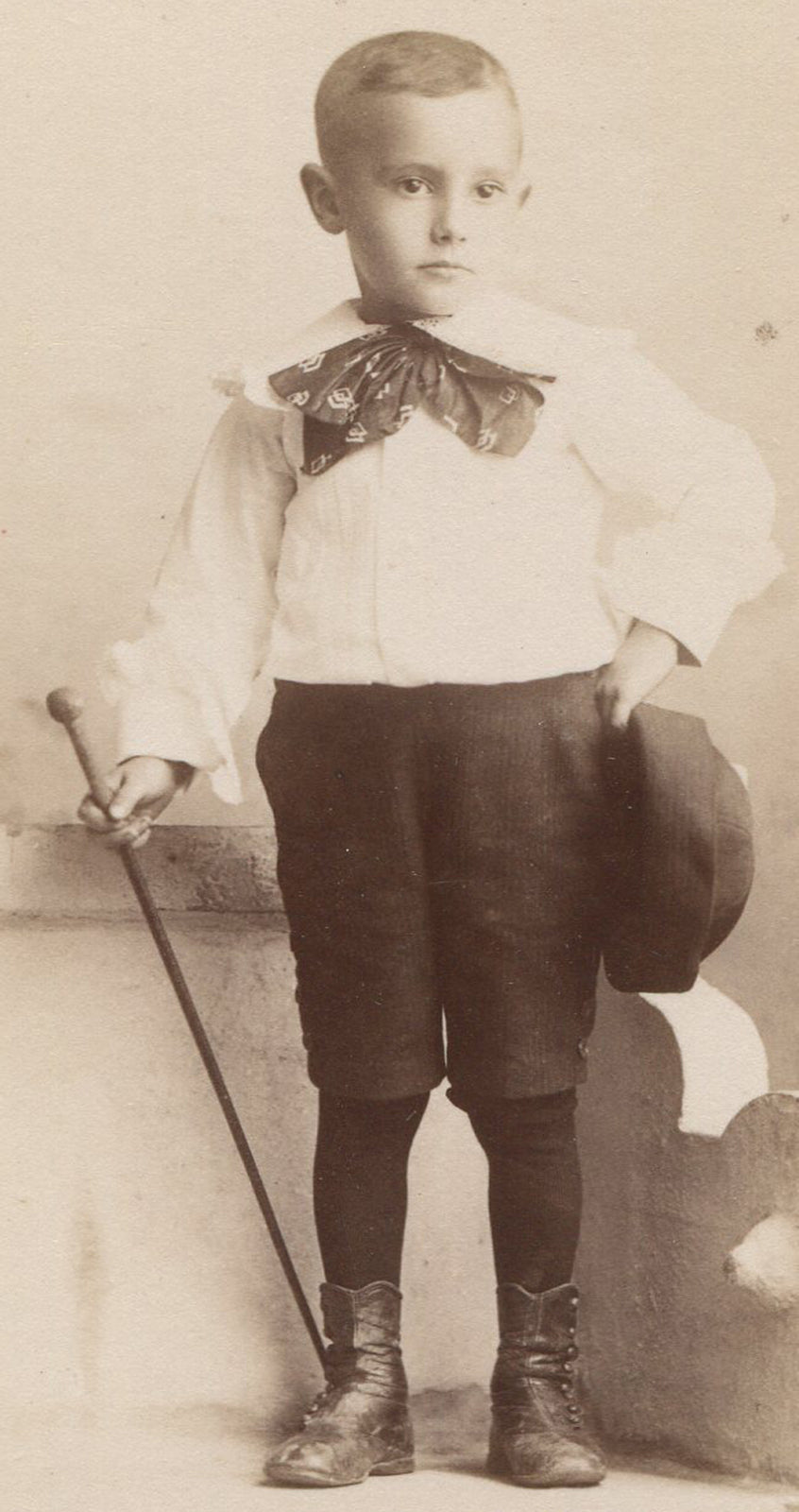YOUNG BOY POSED ON BENCH, CANE AND HAT. CABINET CARD ST. LOUIS, MO.