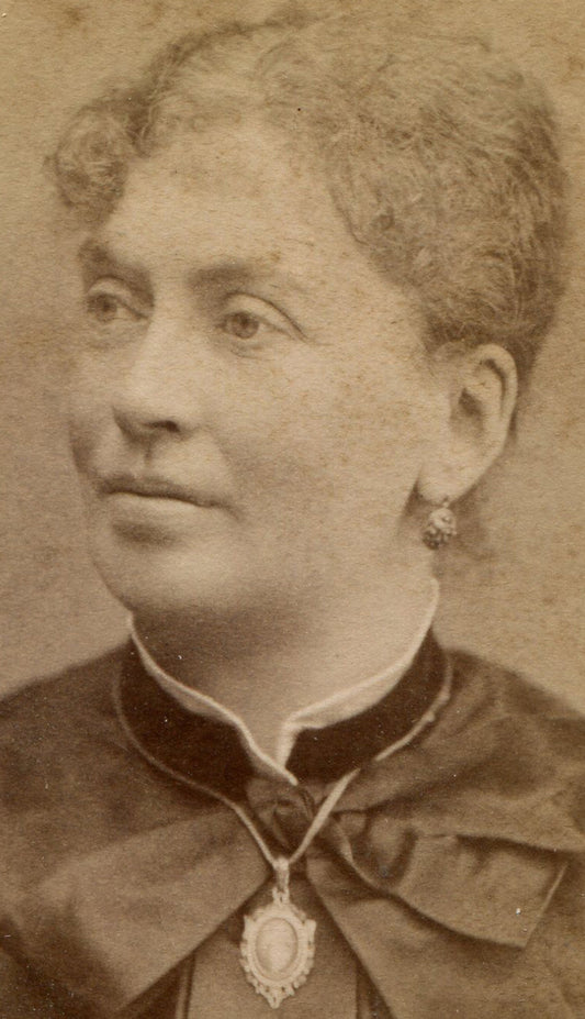 WOMAN, ARCHED EYEBROWS, EARRINGS. CDV. STOCKHOLM, SWEDEN.