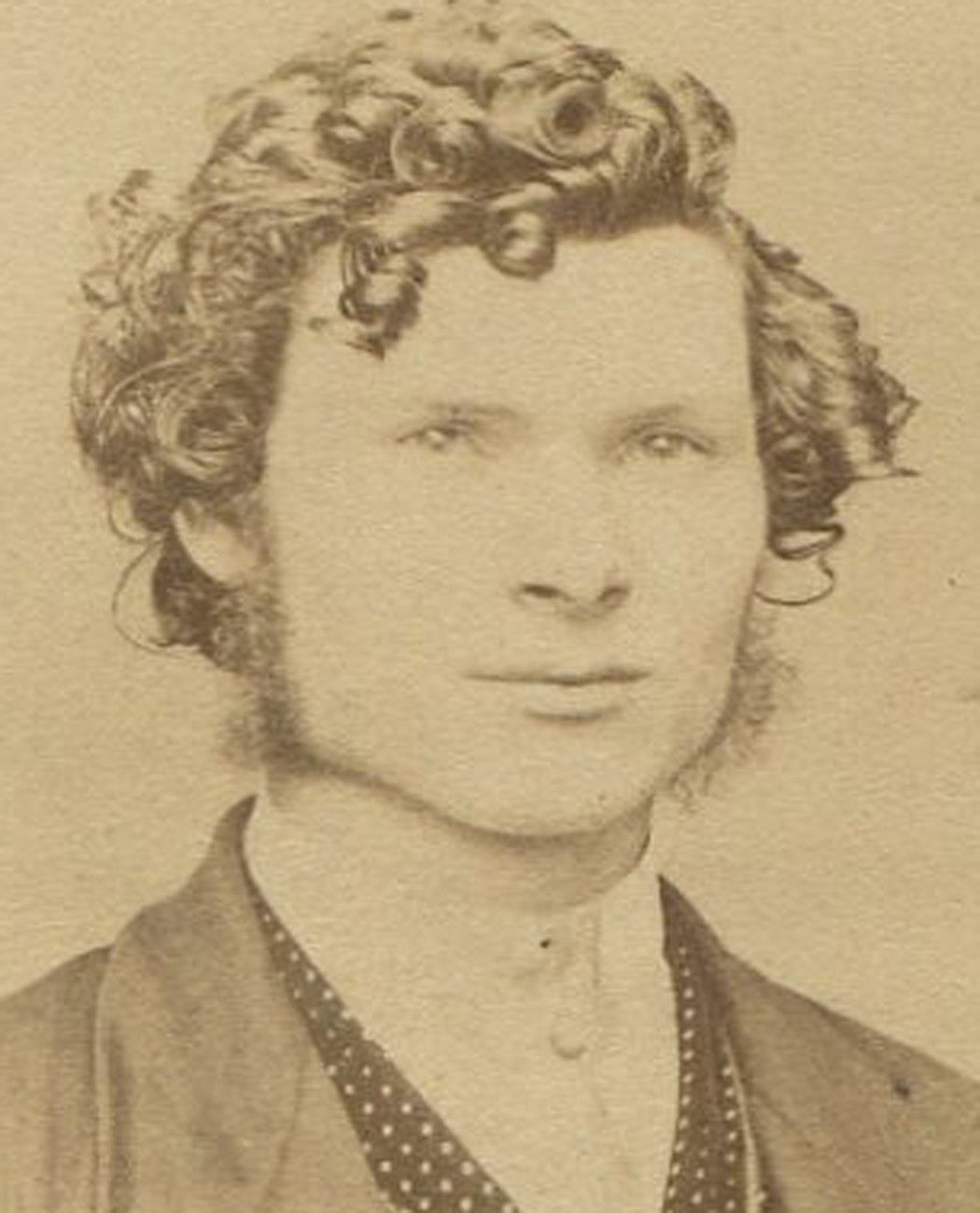 HANDSOME YOUNG MAN WITH WILD CURLY HAIR, POLKA DOT VEST. CDV. PITTSBURGH, PA.