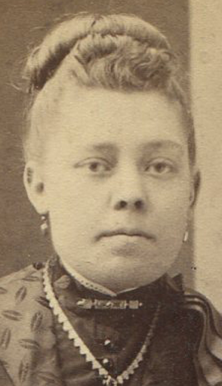 Vintage cabinet card photo of an ethnic-looking woman with painted backdrop -- Canton, Ohio, early 20th century portrait