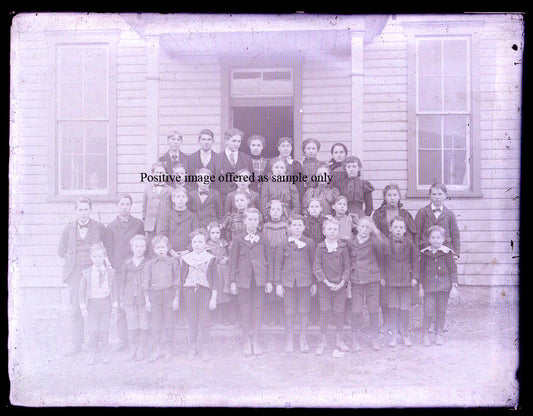 STUDENT PHOTO, ONE ROOM SCHOOLHOUSE. GLASS PLATE NEGATIVE, 8.5 X 6.5 INCHES.