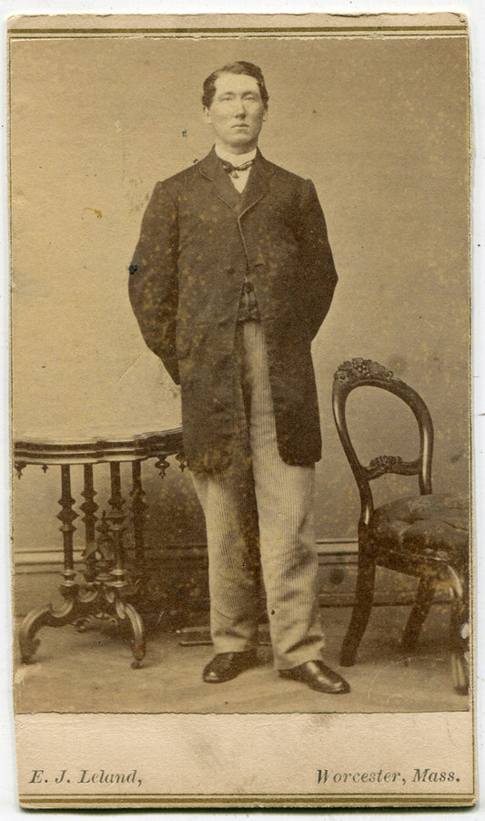 MAN IN STRIPED PANTS AND LONG COAT. CDV. WORCESTER, MASS.