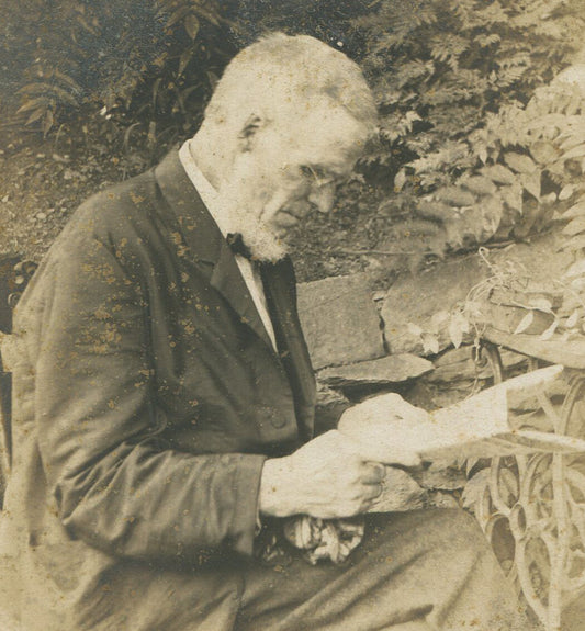 BESPECTACLED OLD MAN READING A LETTER. CABINET CARD.