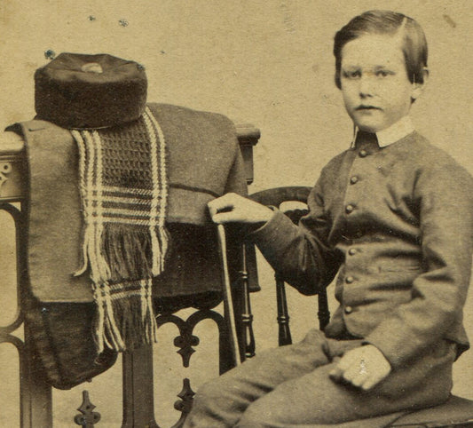 YOUNG BOY POSED NEXT TO FOLDED COAT, SCARF, HAT. CDV. HARTFORD, CONN.