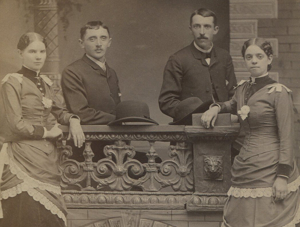 Vintage cabinet card photo: two couples in bowler hats, ornate studio backdrop, early 20th-century portrait