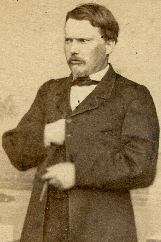 MAN POSED HOLDING CIGAR, REACHING INTO COAT. CDV.
