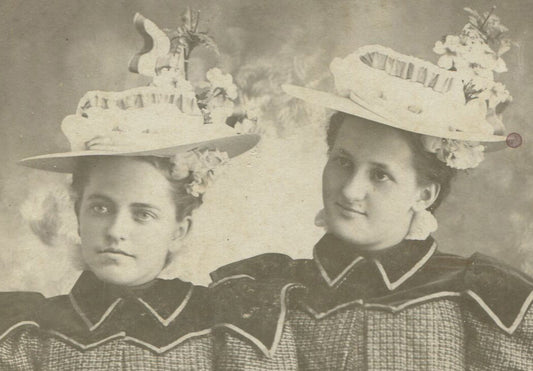YOUNG WOMEN IN OUTLANDISH HATS, MATCHING DRESSES. 1900.