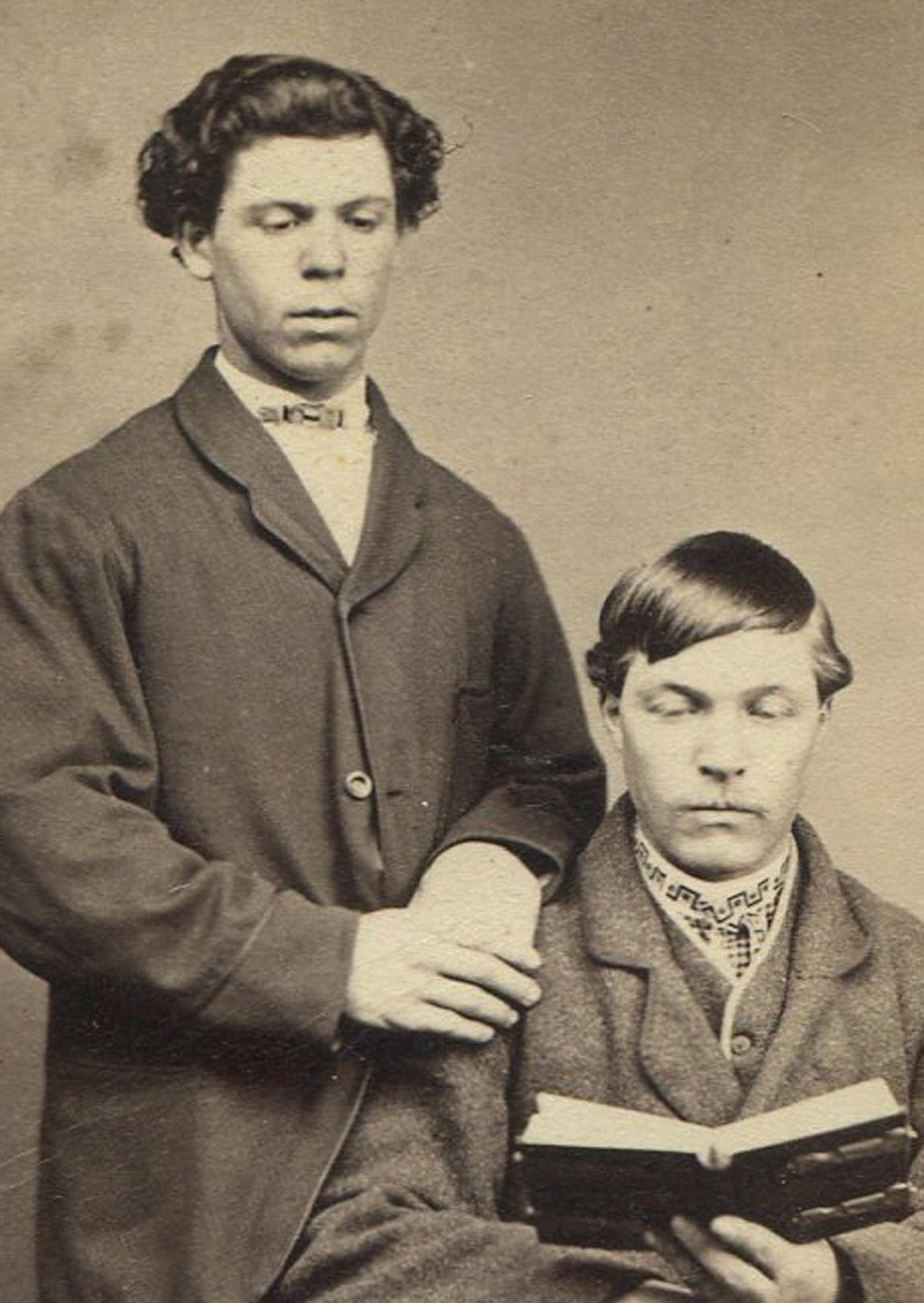 MEN POSED READING BOOK. UNIQUE.