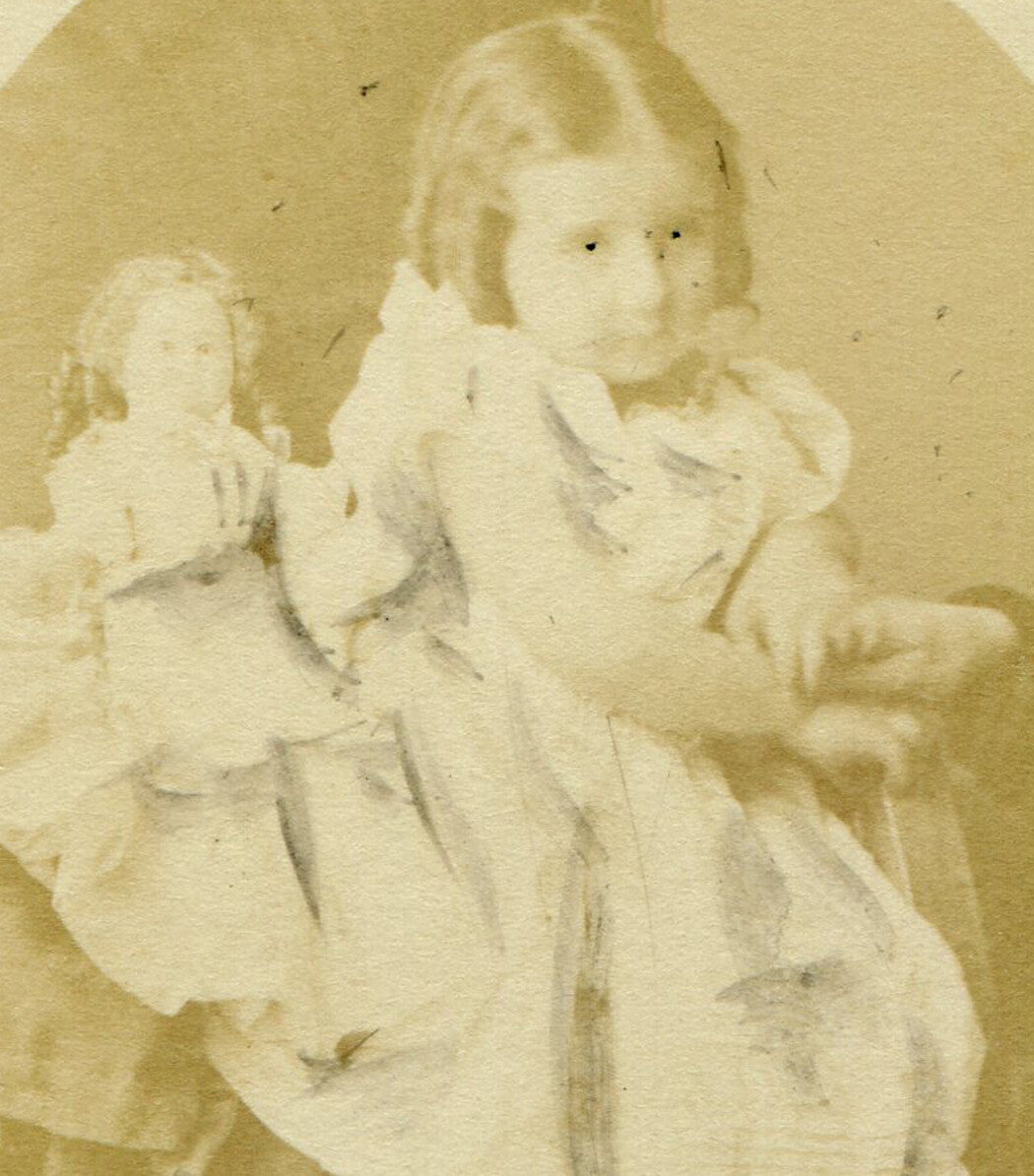 CHILD, SEATED W/ DOLL, HIDDEN FIGURES HAND. CDV.