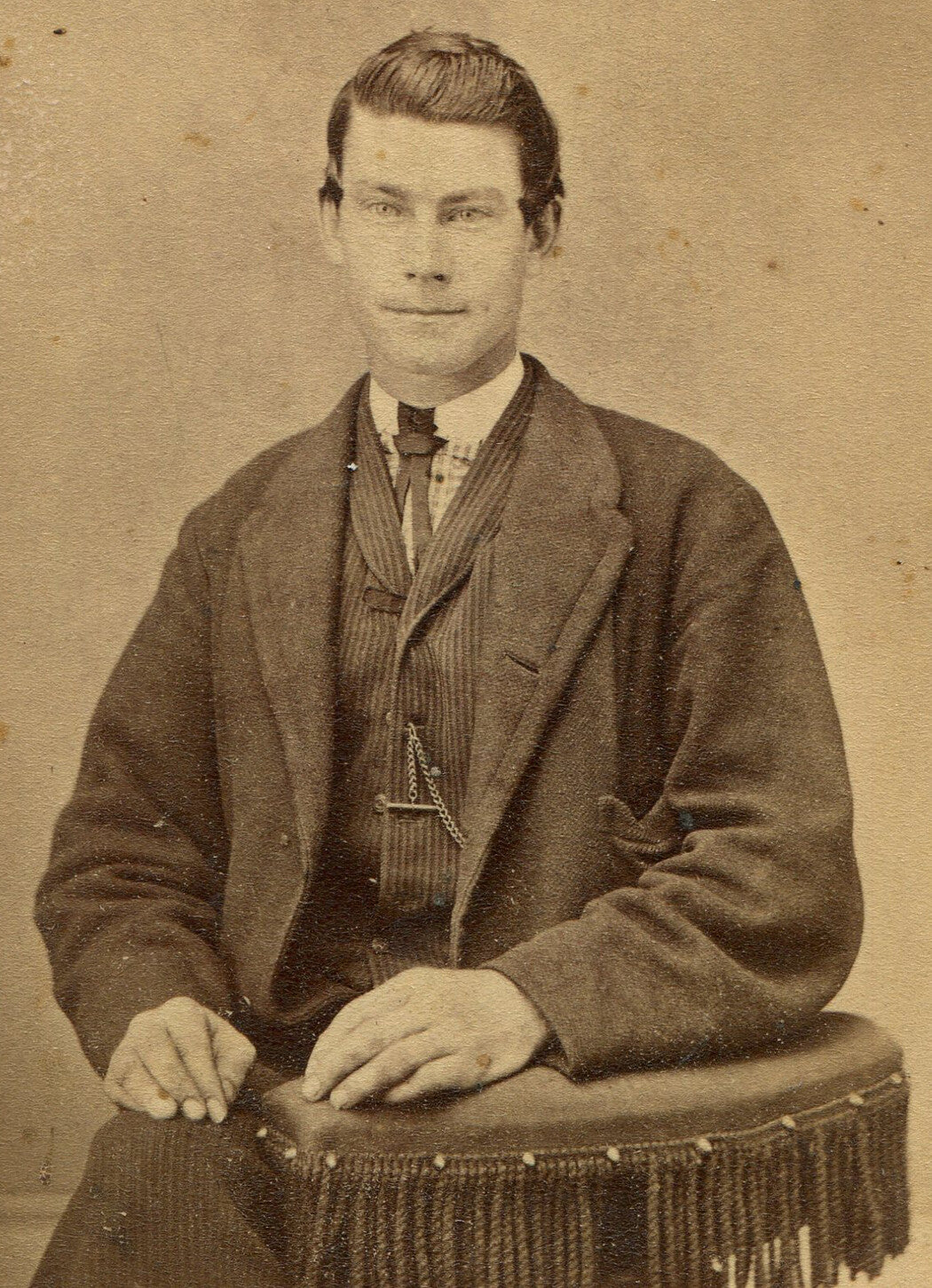 CUTE YOUNG MAN WITH IMPISH GRIN. CDV. MUSKEGON, MICHIGAN.